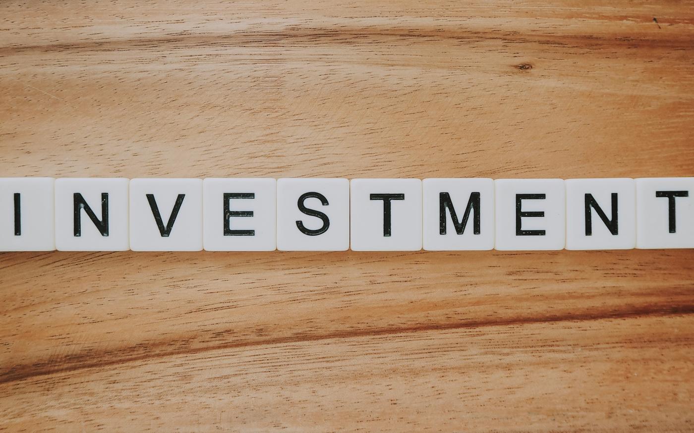 Investment Scrabble text by Precondo CA courtesy of Unsplash.