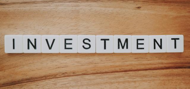 Investment Scrabble text by Precondo CA courtesy of Unsplash.